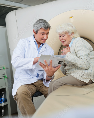 Photo: Doctor Explaining Female Patient Doctor Explaining Female Patient