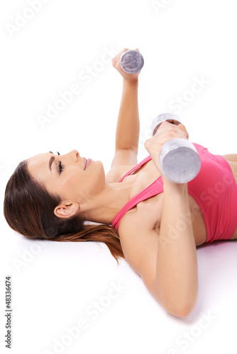 Photo: Woman exercising with barbells Woman exercising with barbells