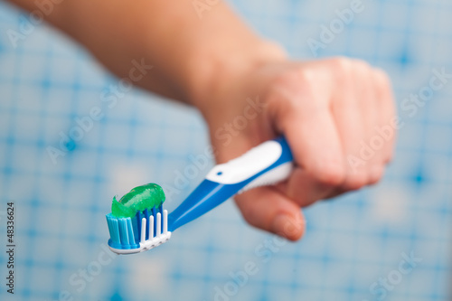 Photo: toothbrush in hand toothbrush in hand