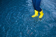 rubber boots walking in the water
