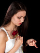 Rose pricking a finger
