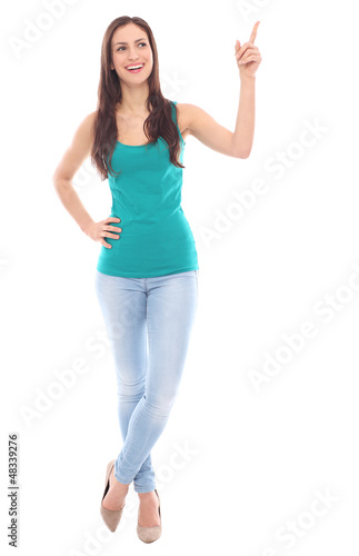 Photo: Young woman pointing up Young woman pointing up
