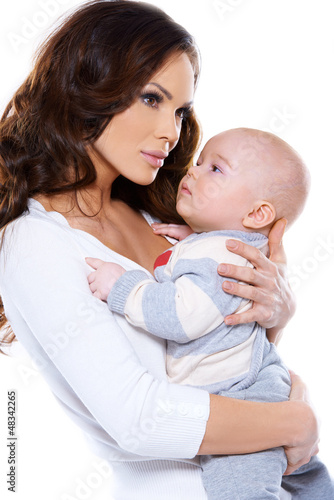 Photo: Beautiful mother cradling her little baby Beautiful mother cradling her little baby