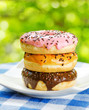 Fresh donuts on nature background