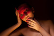 Woman with Creative Make-up with Strass in her Face