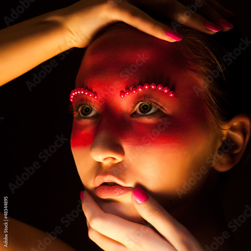 Photo: Fantasy. Portrait of Woman with Painted Face Close Up Fantasy. Portrait of Woman with Painted Face Close Up
