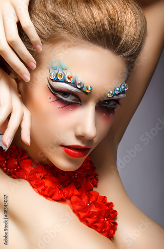 Photo: Fashion Woman Face with Strass - Bright Eye Makeup. Theater Fashion Woman Face with Strass - Bright Eye Makeup. Theater