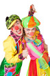 Two clown smiling isolated over a white background