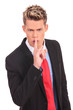 business man showing silence gesture