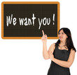 Business Woman pointing up to a sign