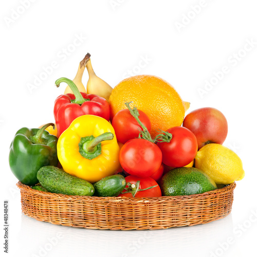 Photo: fruits and vegetables in basket isolated on a white background fruits and vegetables in basket isolated on a white background
