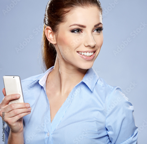 Photo: Beautiful smiling business woman talking on the phone Beautiful smiling business woman talking on the phone