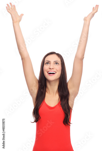 Photo: Young woman with arms raised Young woman with arms raised