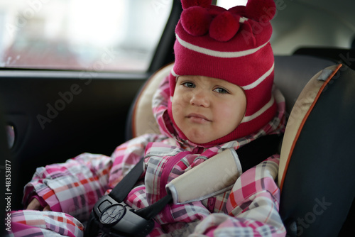 Photo: sad baby in car seat sad baby in car seat