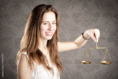 Photo: woman holding an hourglass woman holding an hourglass