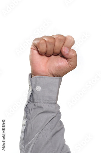 Photo: man hand, hold in fist man hand, hold in fist