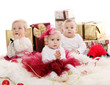 Photo: Babies with gifts celebrate Christmas Babies with gifts celebrate Christmas