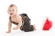 Beautiful toddler in worker coveralls
