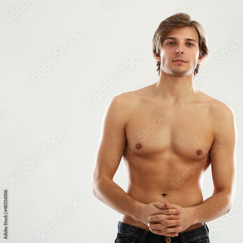 Photo: Young beautiful man with naked torso Young beautiful man with naked torso