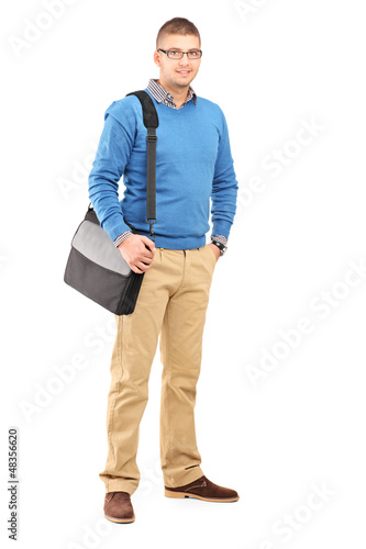 Photo: Full length portrait of a young man with a shoulder bag Full length portrait of a young man with a shoulder bag
