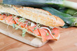 Photo: Smoked salmon sandwich with capers on baguette Smoked salmon sandwich with capers on baguette