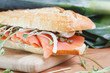 Photo: Smoked salmon sandwich with capers on baguette Smoked salmon sandwich with capers on baguette