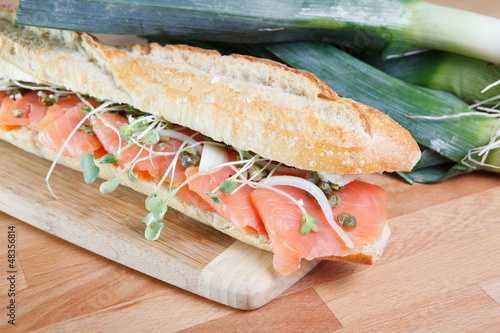 Photo: Smoked salmon sandwich with capers on baguette Smoked salmon sandwich with capers on baguette