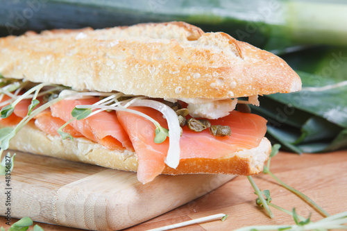 Photo: Smoked salmon sandwich with capers on baguette Smoked salmon sandwich with capers on baguette