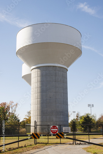 Photo: Water Towers Behind Fence Water Towers Behind Fence