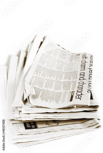Photo: stack of newspapers isolated stack of newspapers isolated