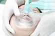 Breathing mask to the patient's face. Phase of resuscitation.