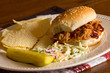 Pulled pork sandwich ,coleslaw and pickle