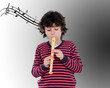 Photo: Adorable child playing flute Adorable child playing flute