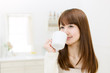 Foto: Beautiful asian woman in the kitchen Beautiful asian woman in the kitchen