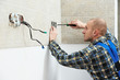 Photo: Electrician installing wall outlets Electrician installing wall outlets
