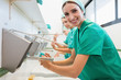 Photo: Surgeons washing their hands while smiling Surgeons washing their hands while smiling