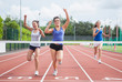 Athletes celebrating as they cross finish line