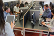 Woman holding a tablet pc while teaching her class