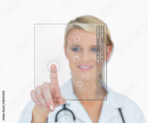 Photo: Doctor touching holographic interface Doctor touching holographic interface