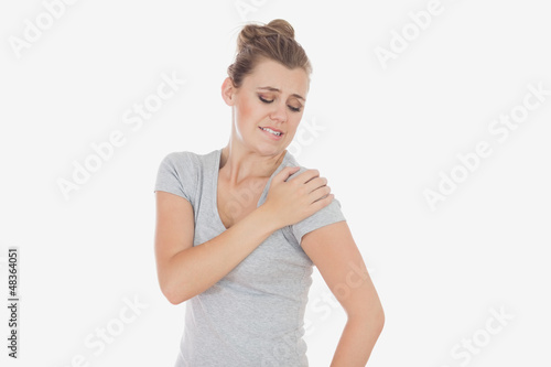 Photo: Woman suffering from shoulder pain Woman suffering from shoulder pain