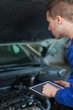 Mechanic using digital tablet