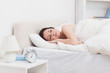 Young woman in bed