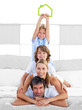 Jolly family having fun with green house illustration