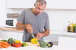 Man cutting pepper