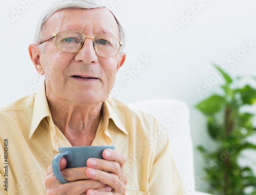 Photo: Elderly man with a cup Elderly man with a cup