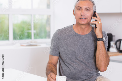 Photo: Man calling someone Man calling someone
