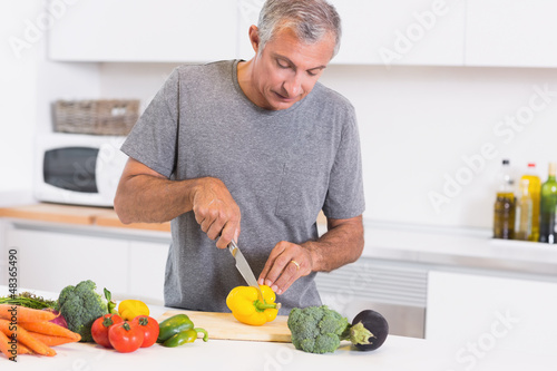 Photo: Man cutting pepper Man cutting pepper