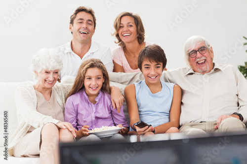Photo: Extended family watching tv Extended family watching tv