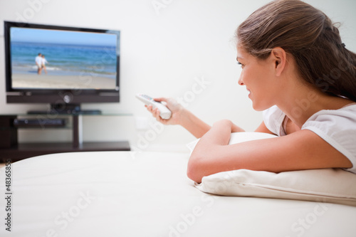 Photo: Woman watching television Woman watching television