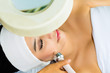 Asian woman getting a facial treatment in spa